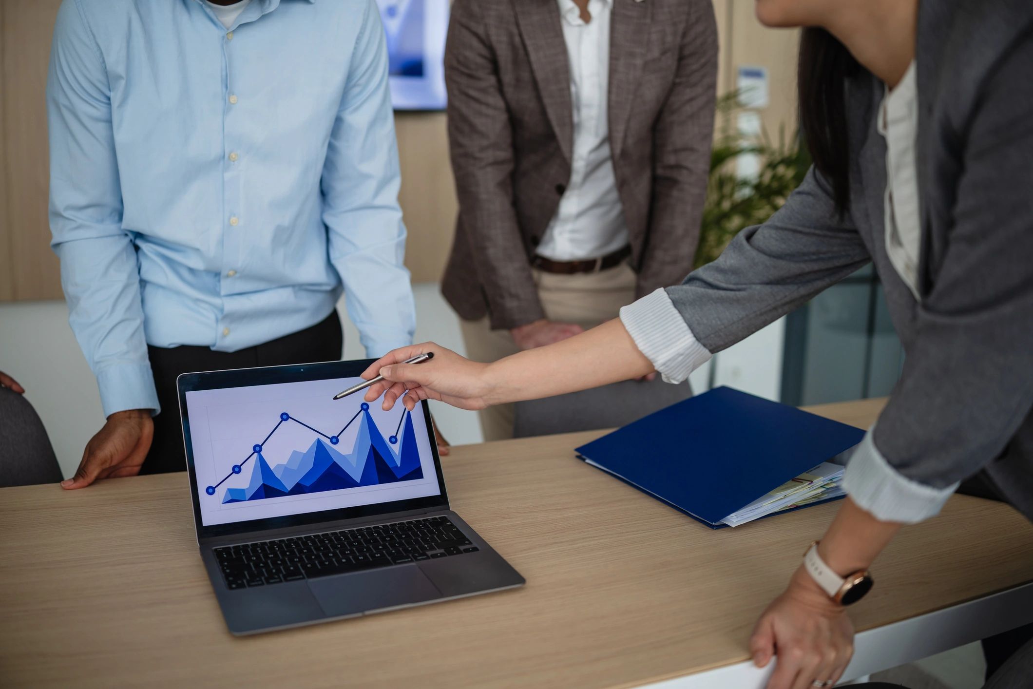 Professionals discussing business performance data